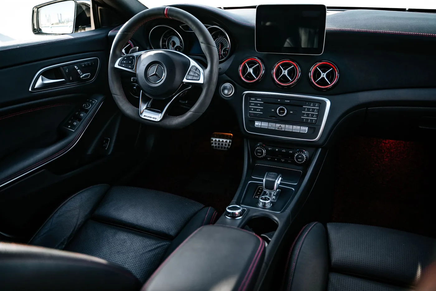 A clean black vehicle interior and dashboard